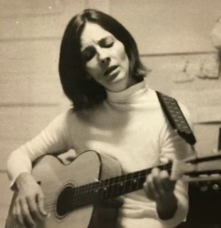 Dorothea Louise Hagle McGuire Moga playing guitar